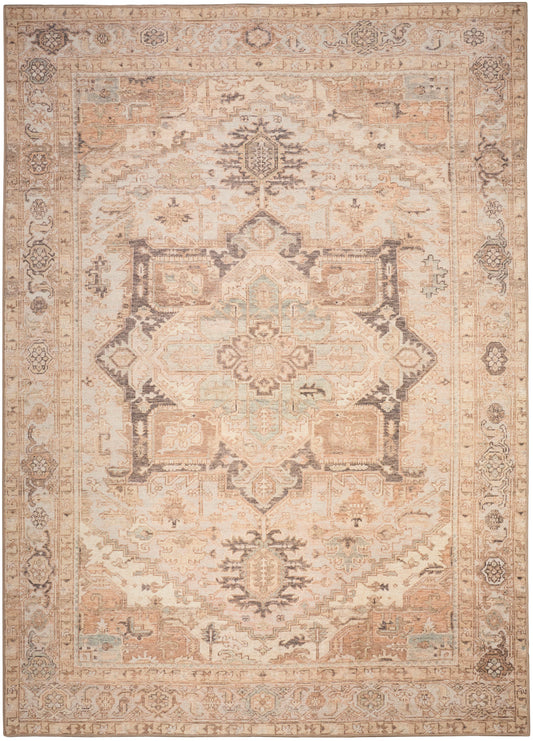 Distressed oriental rug in ivory and peach with a central floral medallion and ornate border in muted blues.