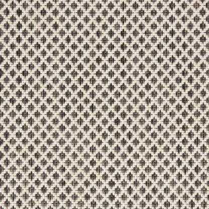 Beige woven upholstery fabric with small dark brown diamond/trellis motifs and jacquard texture.