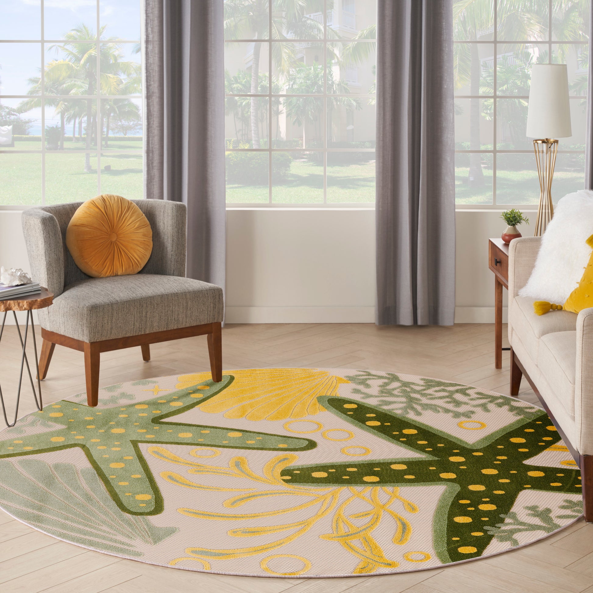 Soft circular outdoor rug with green and yellow palm leaf pattern.