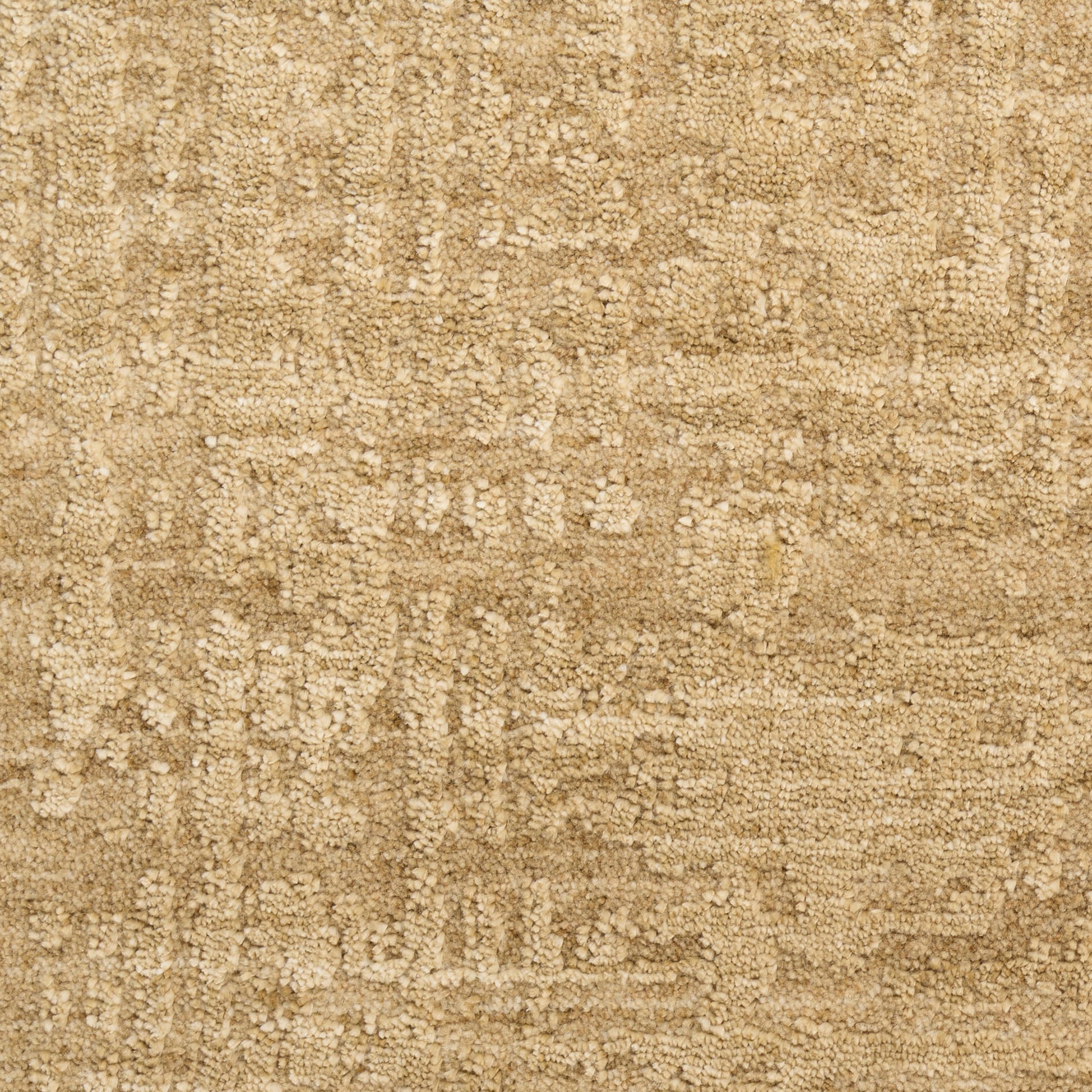 Beige textured rug with a subtle distressed geometric pattern; soft, woven surface.