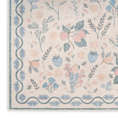 Pastel floral rug with blue and pink flowers, a small blue bird, leafy sprigs on beige, blue scalloped border.