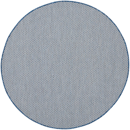 5' round rug with blue border and cream woven lattice texture.