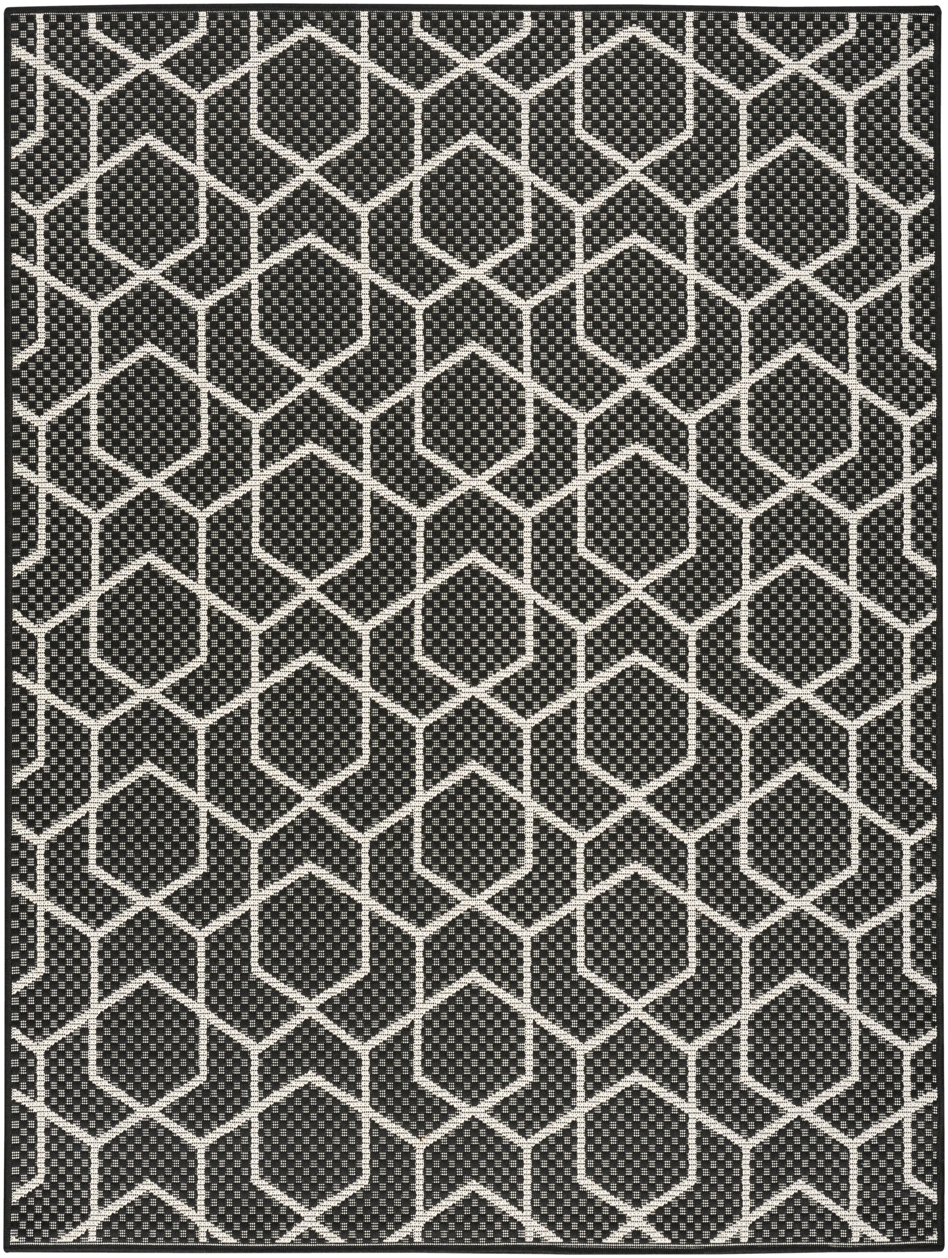 Black area rug with white interconnected hexagon lattice pattern for modern geometric decor.