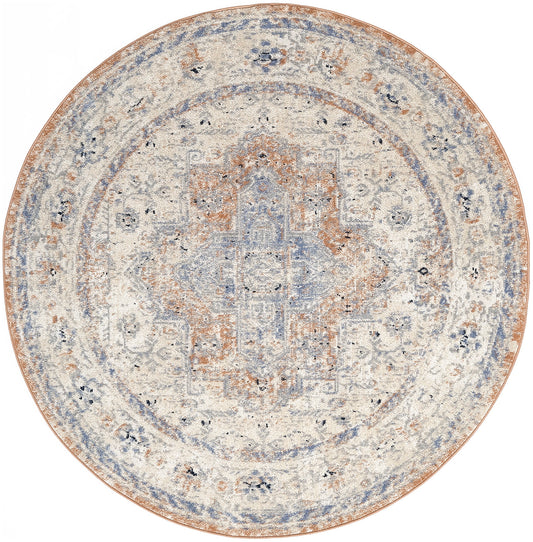 Round distressed oriental rug with ivory base, pale blue & rust medallion, and ornate concentric borders.