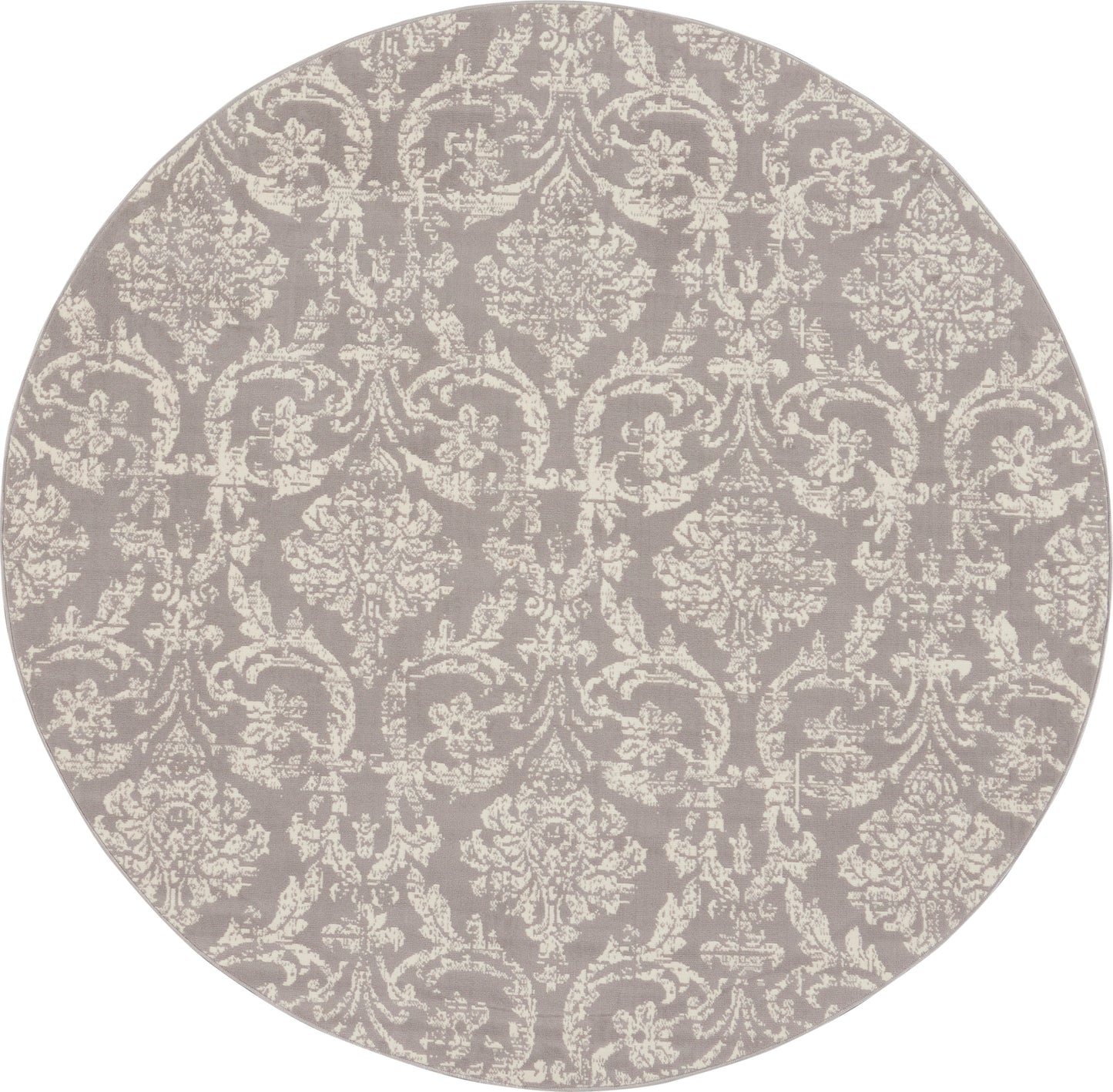 Round rug in muted gray-lavender with ivory damask pattern