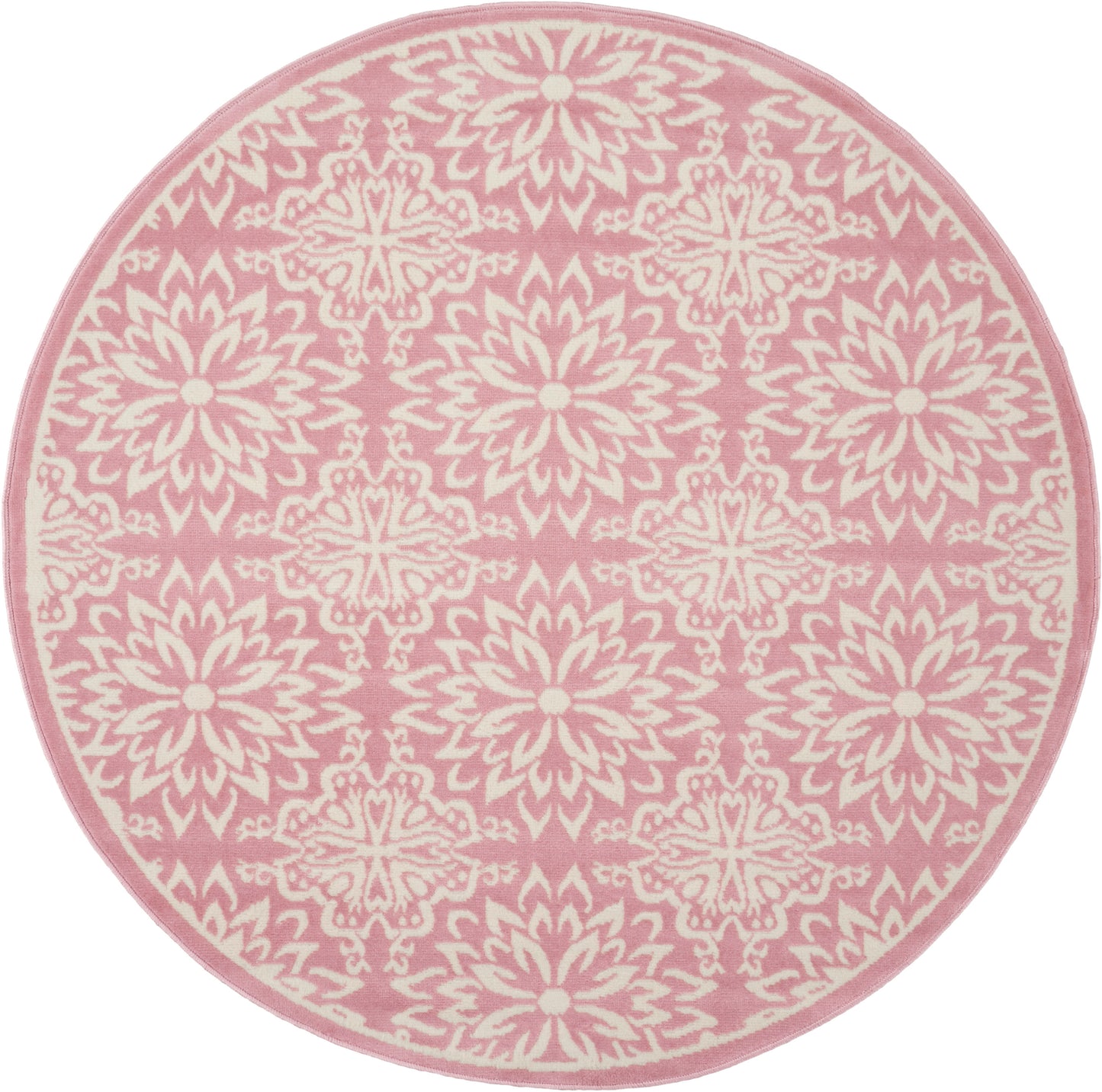 Round pink rug with white mandala floral pattern and pink border.