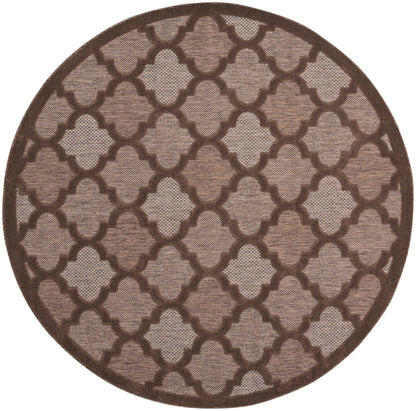 Round brown-tan rug with an interlocking lattice trellis pattern and a textured woven surface.
