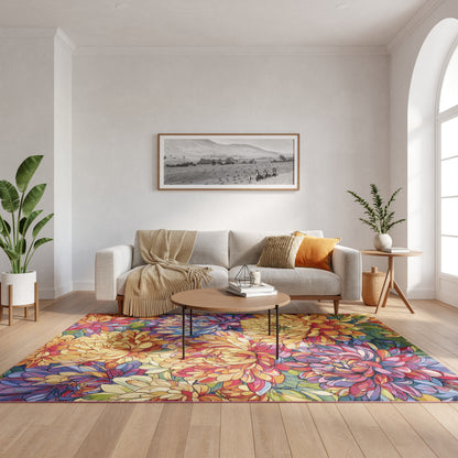 Cozy living room with beige sofa, colorful floral rug, round wood coffee table, and potted plants under an arched window.