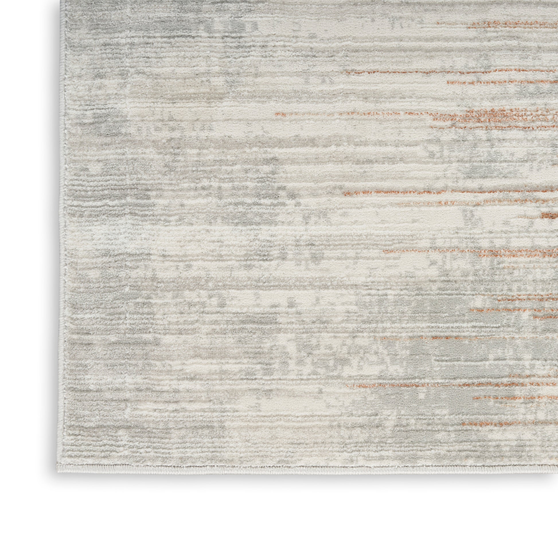 Rectangular area rug in light gray and cream with subtle rust streaks; modern distressed style and plush texture, 8' x 10'.