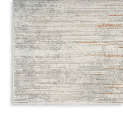 Rectangular area rug in light gray and cream with subtle rust streaks; modern distressed style and plush texture, 8' x 10'.