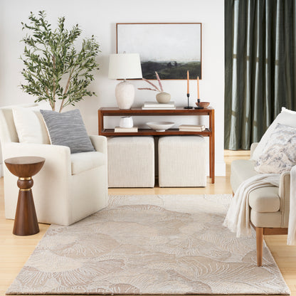 Neutral living room with beige sofa, armchair, wooden console, plant, leaf-pattern rug, cream ottomans, and green curtains.