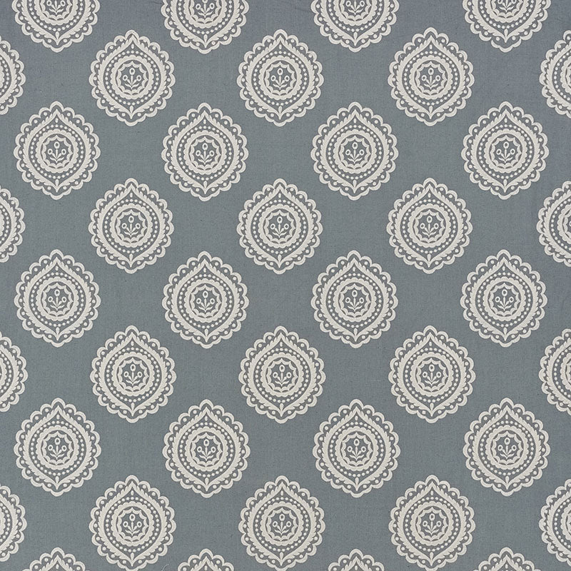 Blue-gray background with repeating white ornate medallion damask pattern, suitable for wallpaper or fabric.