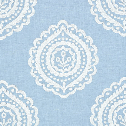 Light blue linen embroidery fabric with repeating white damask-style medallion motifs.