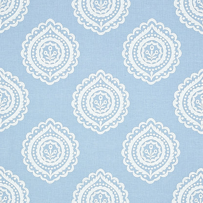 Light blue linen embroidery fabric with white embroidered medallions in a seamless damask-inspired pattern suitable for curtains or upholstery.