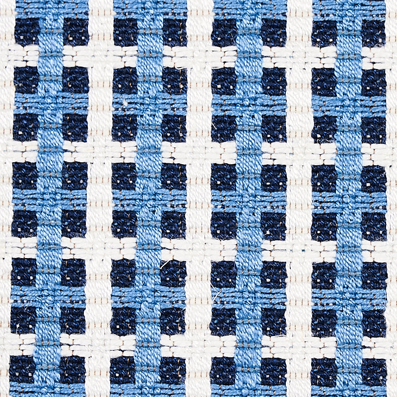 Blue tile-pattern upholstery fabric with a small-scale woven geometric design and textured weave.