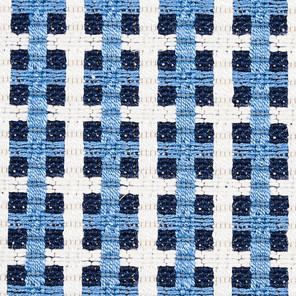 Blue tile-pattern upholstery fabric with a small-scale woven geometric design and textured weave.