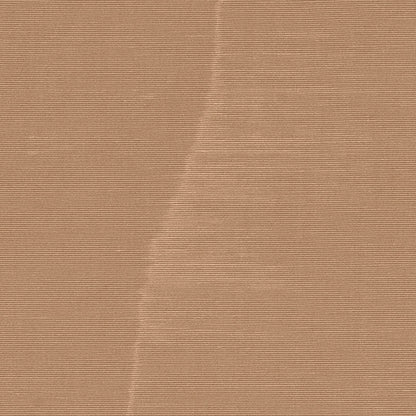 Kraft brown corrugated cardboard sheet with diagonal crease and fine ribbed texture.