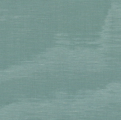 Close-up of petrol moire fabric texture with a subtle watery pattern; suitable for upholstery or apparel.
