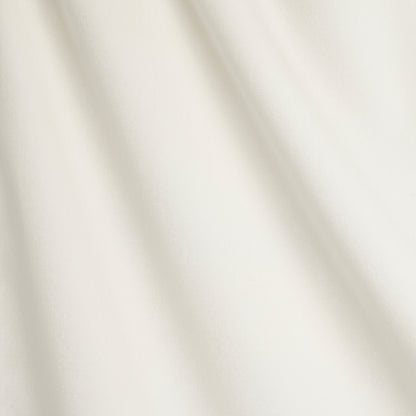 Cream draped fabric with soft diagonal folds and a smooth matte finish.