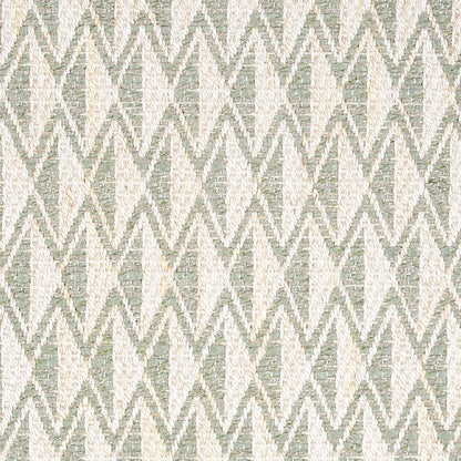 Woven fabric in cream and sage green with a repeating diamond zigzag pattern; textured geometric upholstery.