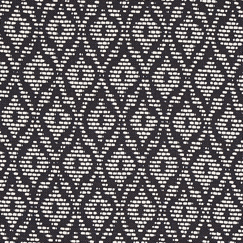 Black fabric with cream diamond lattice pattern; woven geometric textile for upholstery or apparel.