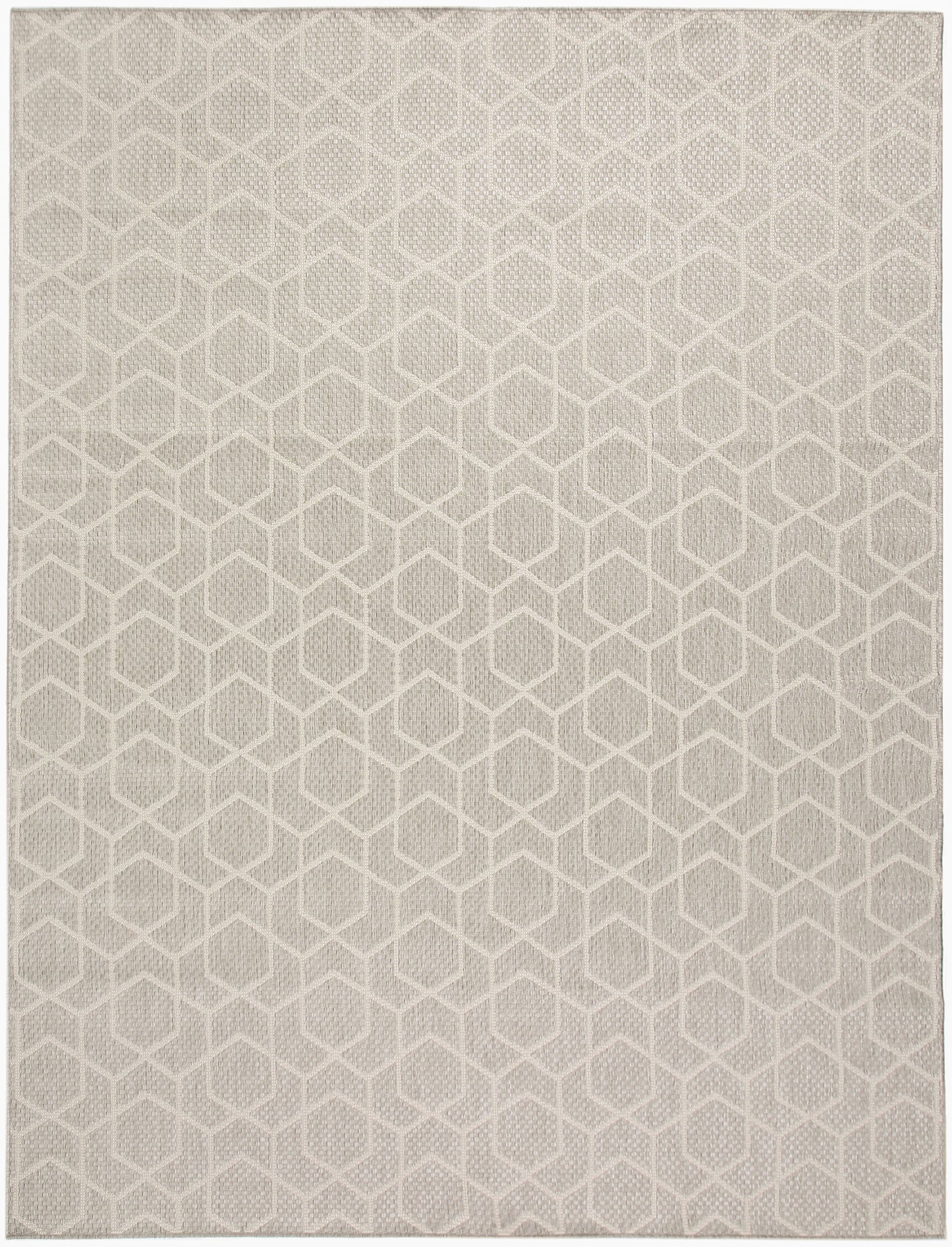 Beige woven rug with a repeating cream hexagonal geometric pattern.