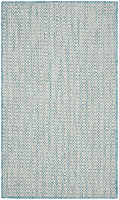 Light blue and white woven area rug with tiny diamond pattern and teal border.