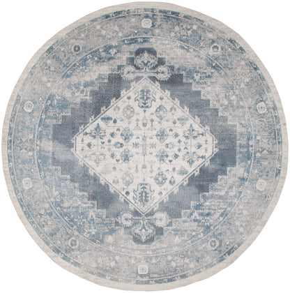 Round distressed blue and ivory rug with central diamond medallion and floral motif; vintage Persian-inspired design.