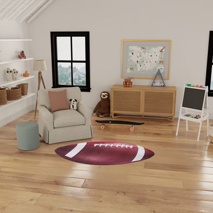Cozy kids’ playroom with football-shaped rug, beige armchair, plush panda, skateboard, wicker baskets, map art, white easel.