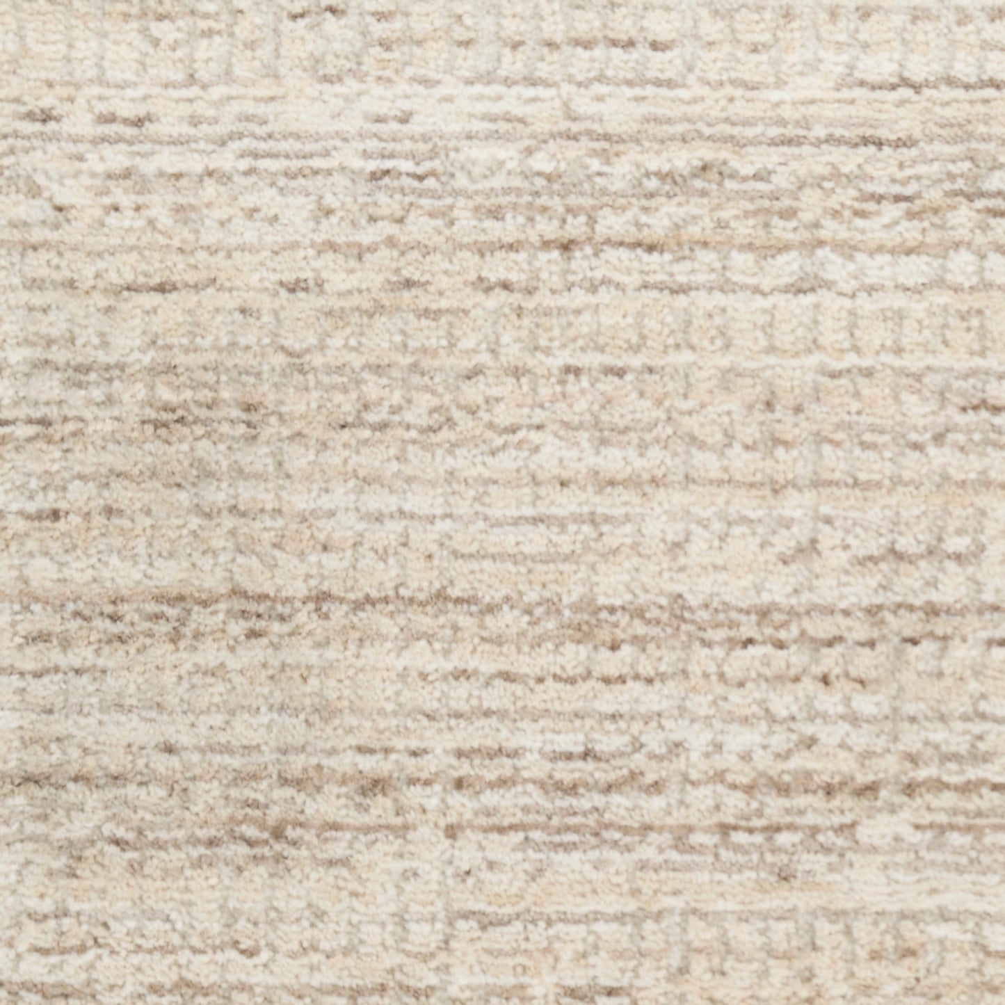 Beige textured rug with cream & tan tonal weave.