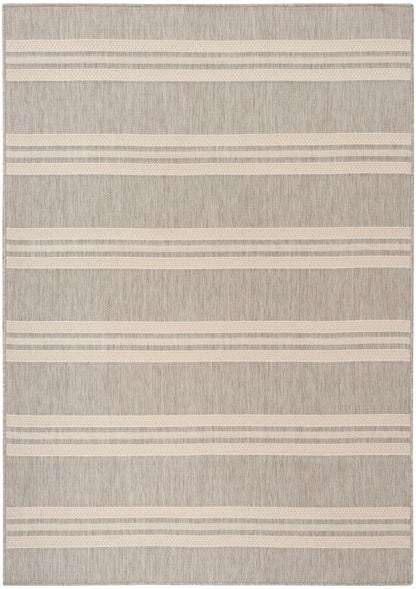 Rectangular beige woven rug with cream and light taupe stripes, textured fabric, casual coastal/modern style.