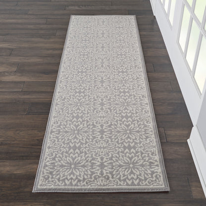 Long hallway runner rug in gray and ivory floral damask pattern with a light border.
