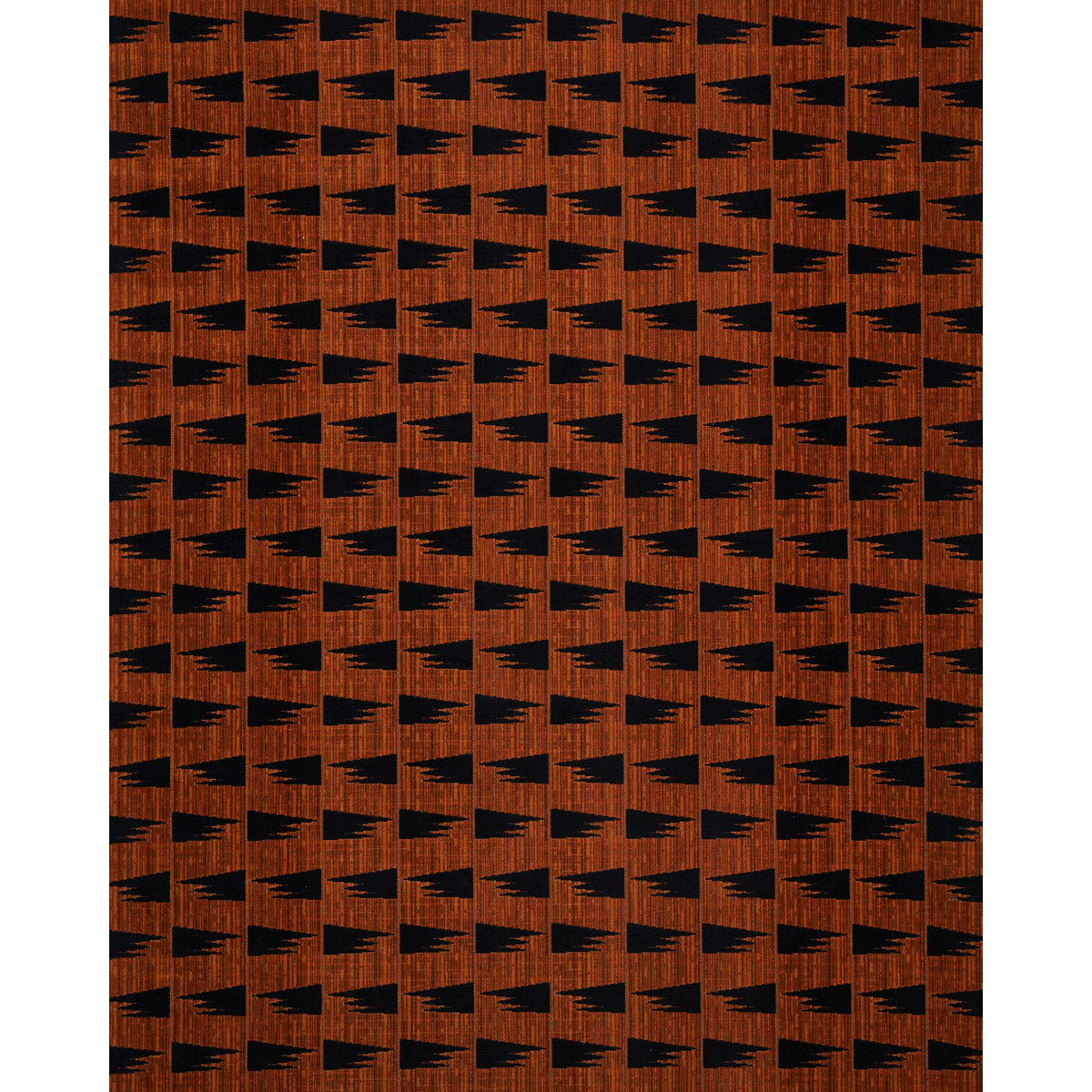 Brown-orange woven fabric with a repeating black triangle/tree motif; geometric retro pattern for upholstery or garments.