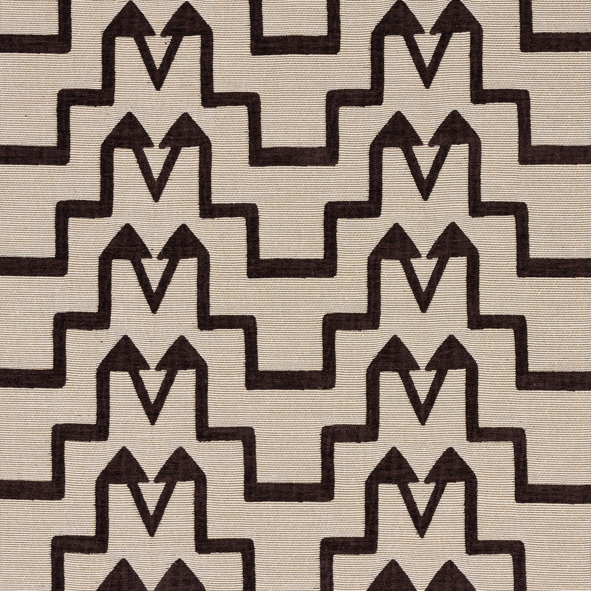 Beige linen-like fabric featuring a repeating dark brown geometric stepped motif for Art Deco-style upholstery.
