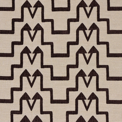 Beige linen-like fabric featuring a repeating dark brown geometric stepped motif for Art Deco-style upholstery.