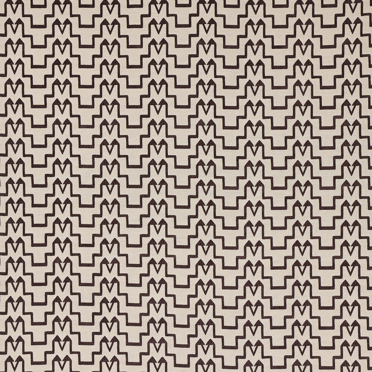 Beige fabric with a repeating dark brown interlocking zigzag M-pattern.