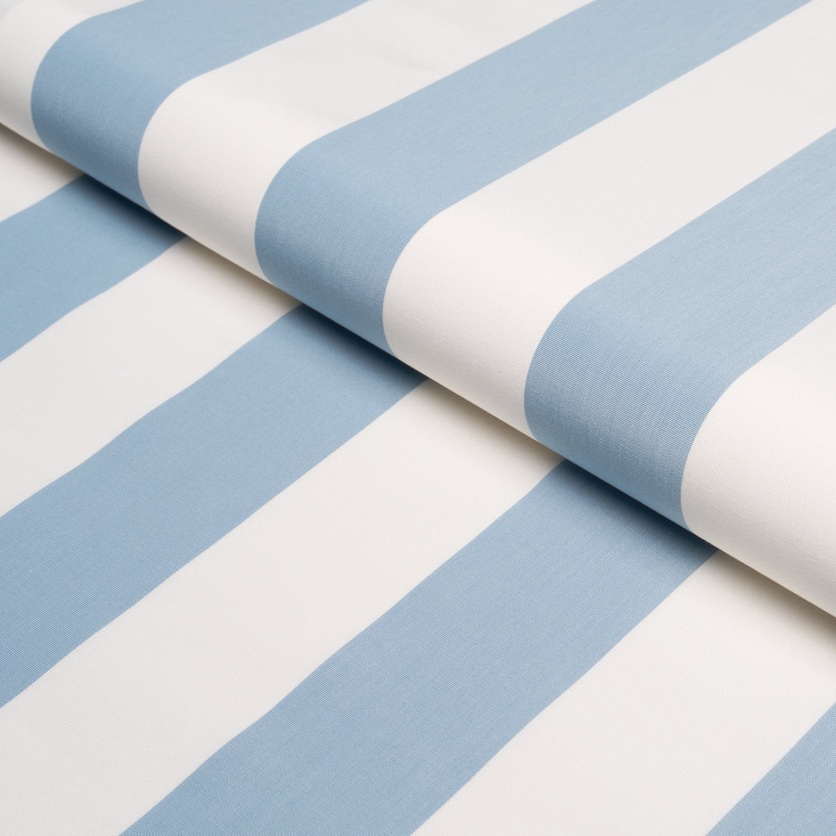 Blue and white striped fabric roll with wide stripes, soft woven textile.
