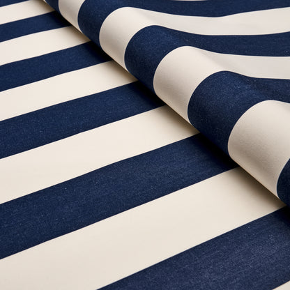 Navy blue and white striped fabric, partially rolled, cotton-like material with bold nautical stripes.