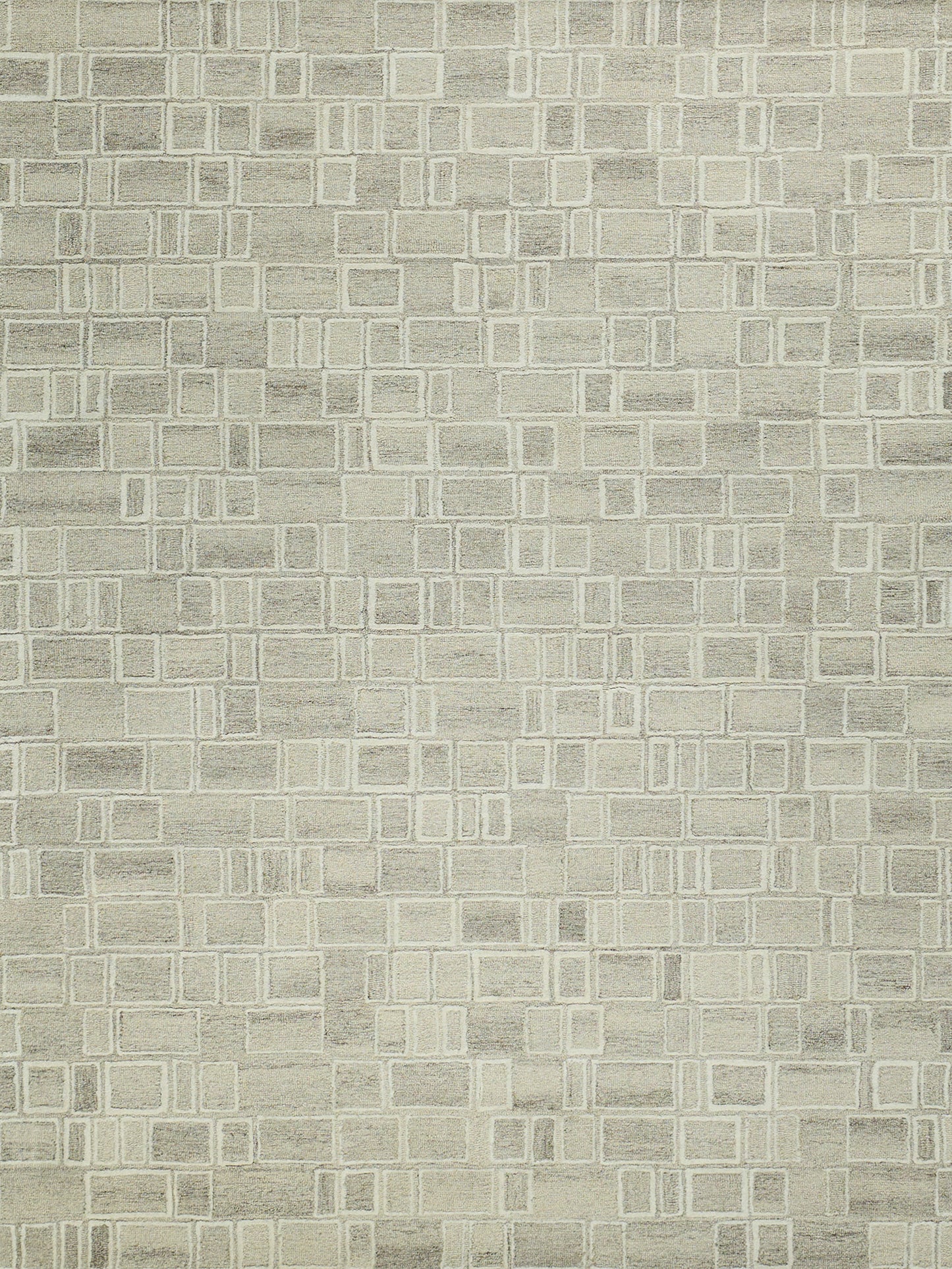 Beige textured area rug with cream-outlined square grid pattern.