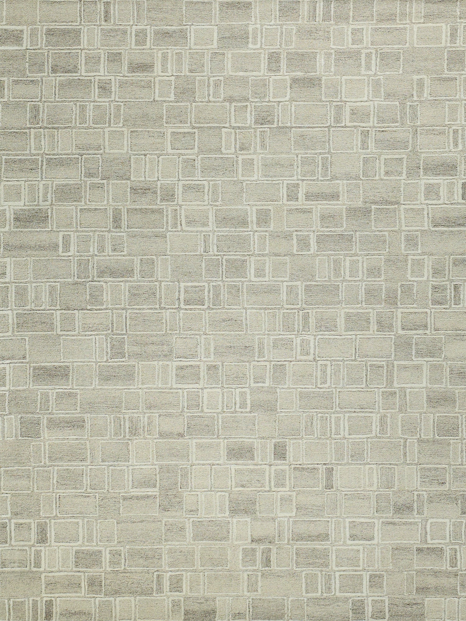 Beige textured area rug with cream-outlined square grid pattern.