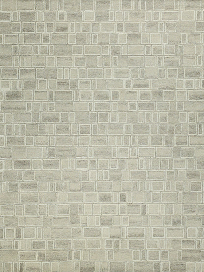 Beige textured area rug with cream-outlined square grid pattern.