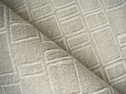 Beige indoor hand-tufted rug with a raised square grid pattern (4' x 6').