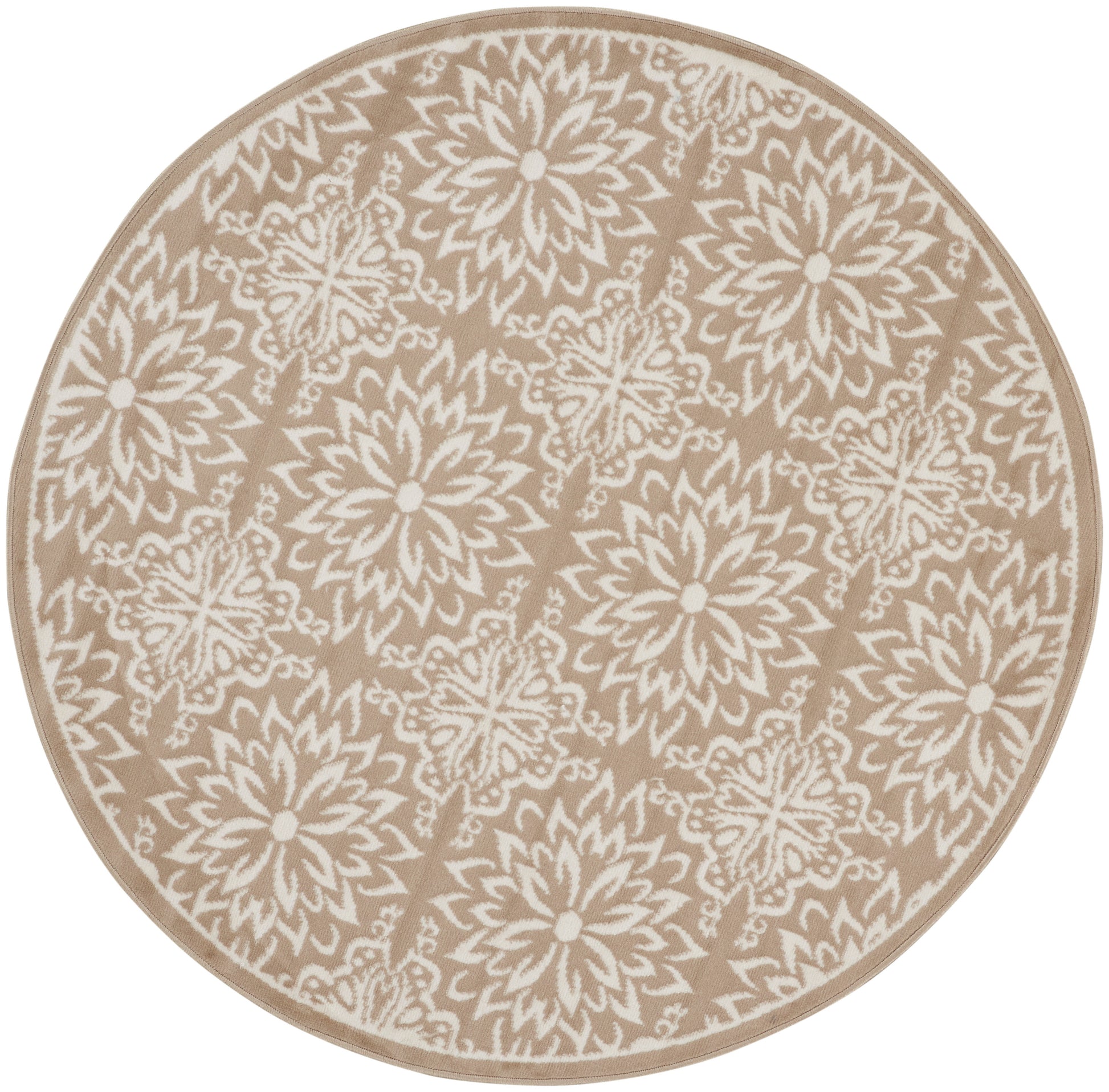 Round beige rug with white floral mandala motifs and beige border.