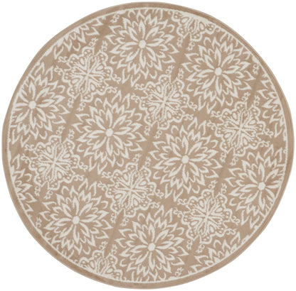 Round beige rug with white floral mandala motifs and beige border.