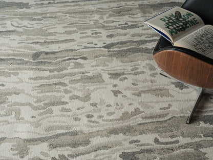 Neutral beige-gray abstract patterned area rug with soft pile, modern home decor.