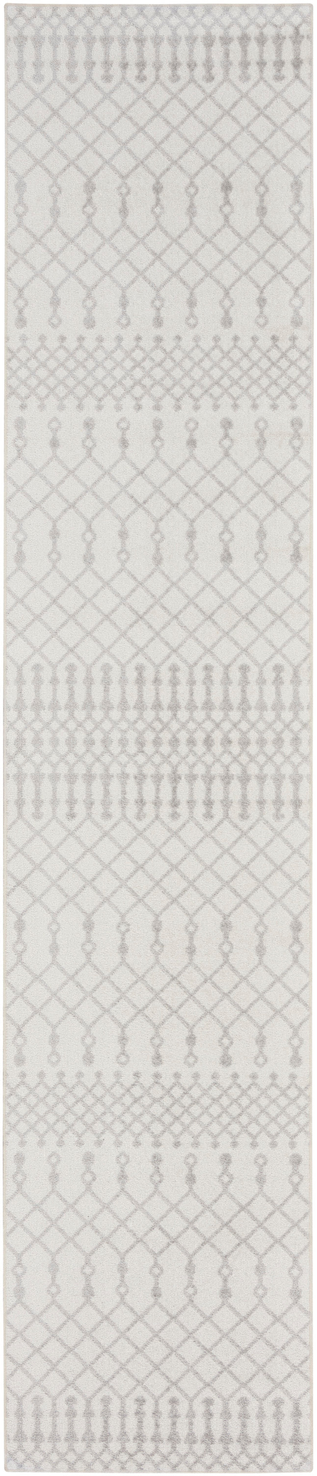 Light gray bohemian trellis rug runner with repeating arches and diamonds; geometric floor covering.
