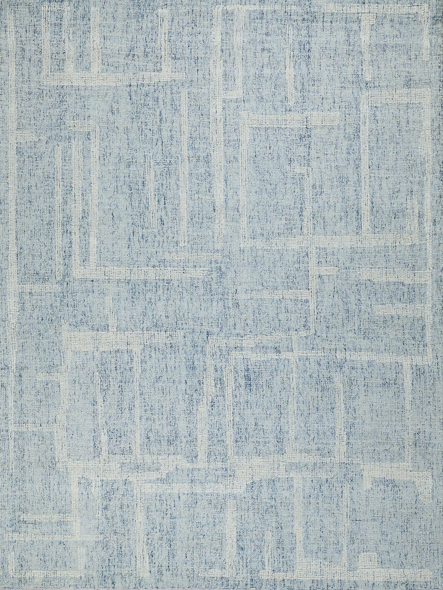 Blue area rug, rectangular shape, distressed geometric pattern in varying blue tones; modern casual home decor.