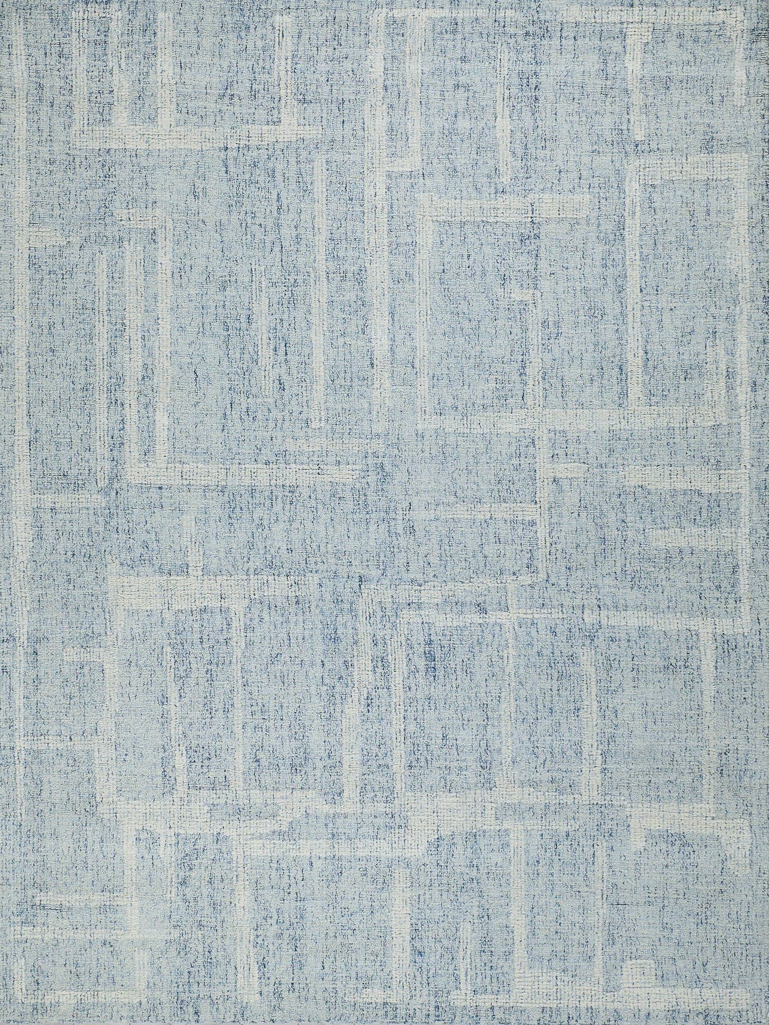 Blue area rug, rectangular shape, distressed geometric pattern in varying blue tones; modern casual home decor.