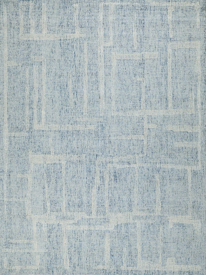 Blue area rug, rectangular shape, distressed geometric pattern in varying blue tones; modern casual home decor.