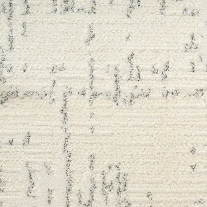 Cream shag rug with subtle gray linear pattern and plush pile.